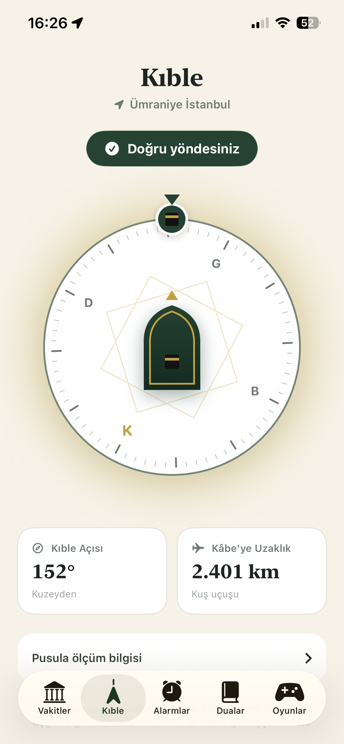 The qibla compass with direction and distance information.